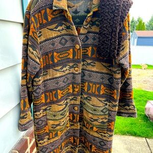 Women’s 3/4 length coat. Dense material, good through fall months